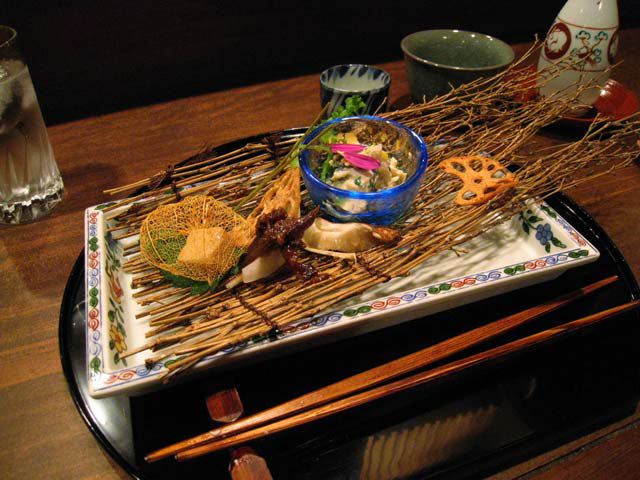 Kaiseki dish on a mat of sticks