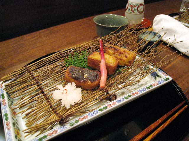 Another dish served on a bed of twigs