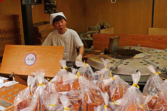 Woman making Yatuhashi cinnamon tile cookies